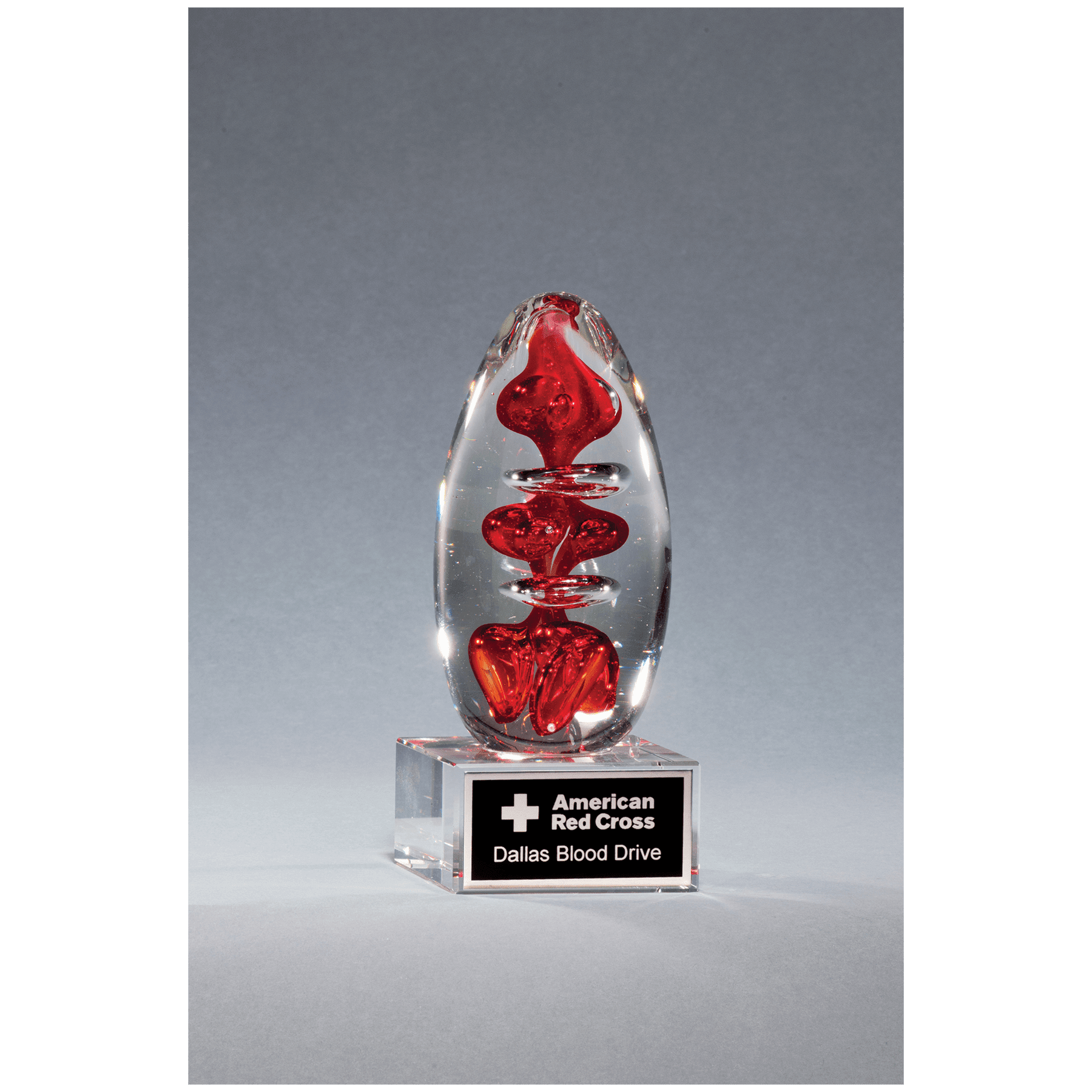 5 1/4" Red Egg Shaped Art Glass on Clear Glass Base with Laserable Aluminum Plate