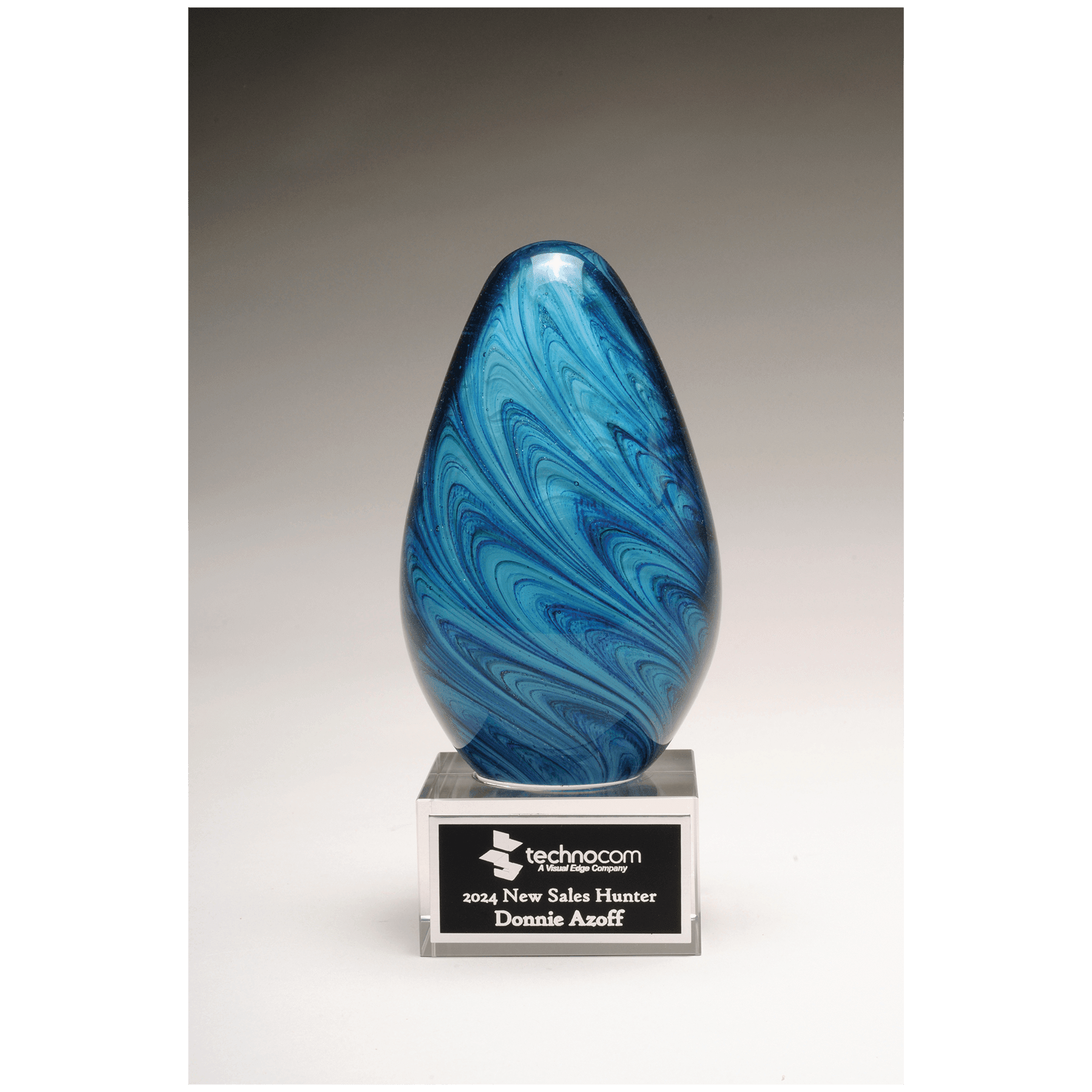 6 1/4" Blue and Green Egg Shaped Art Glass on Clear Glass Base with Laserable Aluminum Plate